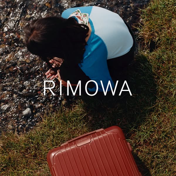 This ad features a RIMOWA suitcase in a natural setting, emphasizing its durability and suitability for outdoor adventur