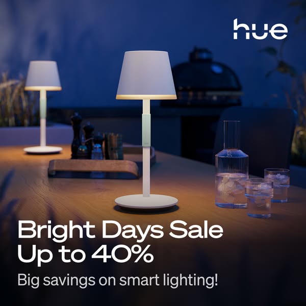 This ad is promoting a sale on smart lighting by Hue, showcasing two cordless table lamps in an outdoor setting with a g