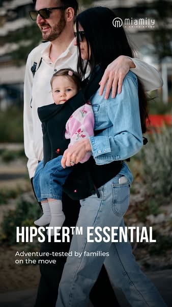 This ad features a family wearing the MIAMILY HIPSTER™ ESSENTIAL baby carrier while out for a walk.