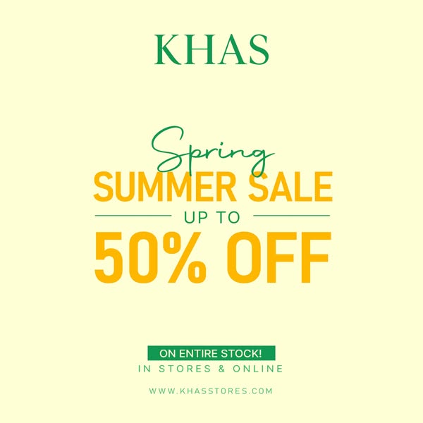 This ad promotes a spring and summer sale from KHAS, offering up to 50% off on their entire stock online and in-stores.