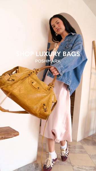 This image ad showcases a luxury bag available from Poshmark and features a model holding the bag.