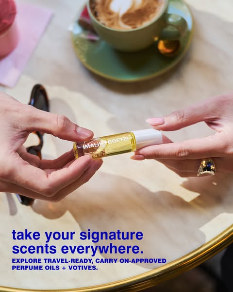 This ad from (MALIN+GOETZ) showcases their perfume oils and votives as a travel-ready, carry-on approved product that al