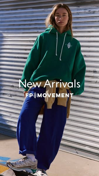 This ad showcases new arrivals from FP Movement, featuring a model wearing a green hoodie and blue pants.