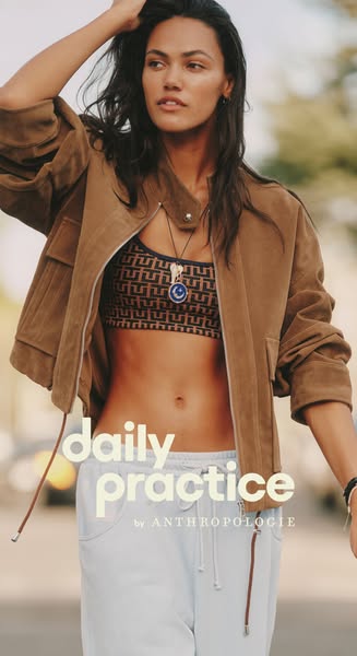 This ad features a model wearing Daily Practice by Anthropologie branded workout clothes, a sports bra and sweatpants, a