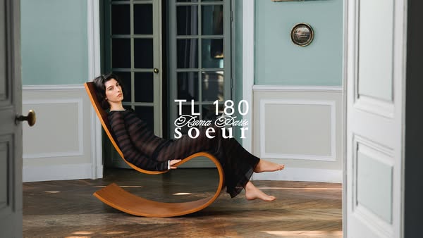 An image of a woman on a chair is shown, with the brand name and product name appearing in front of the image.