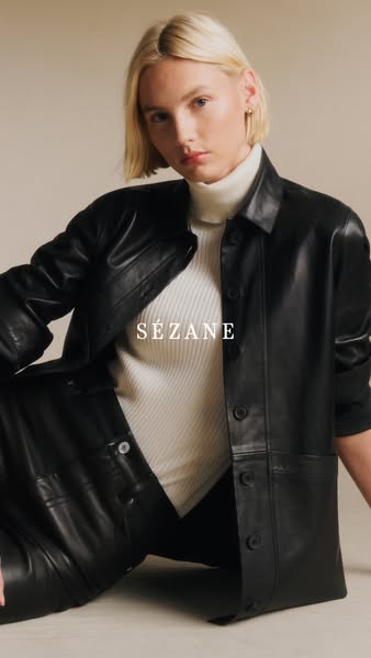 This image ad features a woman wearing a black leather jacket and matching pants from Sézane. The brand name is displaye