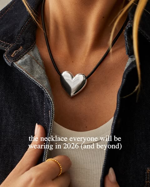 This ad features a close-up shot of a woman wearing a silver heart pendant necklace. The ad copy suggests that this neck