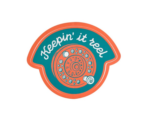 This ad features a sticker with the phrase "Keepin' it reel" and an image of a rotary phone.