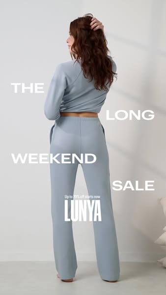 This ad for Lunya features a woman wearing a light blue lounge set. The ad promotes the Lunya brand, highlighting a sale