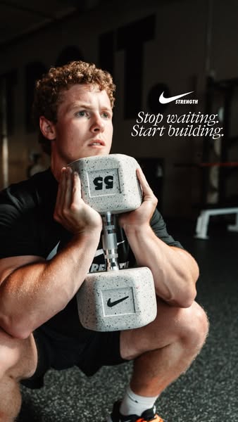 This ad by Nike promotes their strength training equipment. It features a man in workout attire holding a Nike dumbbell 