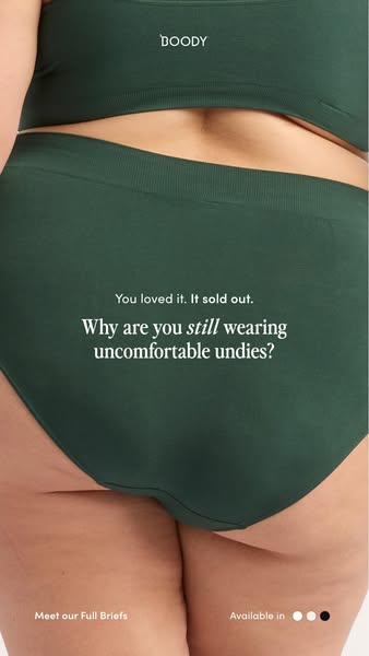 This ad features a close-up shot of a woman wearing green Boody full briefs and a matching bralette. The ad copy emphasi