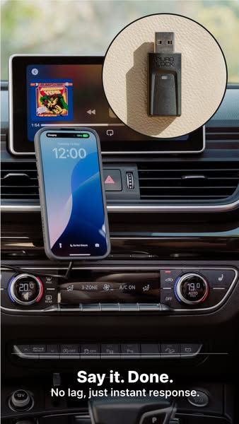 An advertisement for Quad Lock featuring a phone mounted in a car. The advertisement highlights that there is no lag and