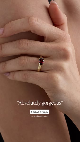 Close up shot of a woman's hand wearing a ring, overlaid with messaging about price and a customer review. This ad e