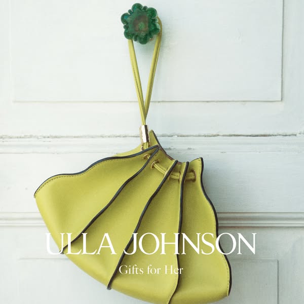 This ad features a handbag hanging on a door. The ad is advertising the brand Ulla Johnson and is intended to be a gift