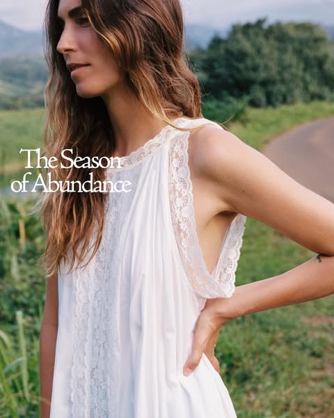 This image ad showcases a white nightgown with lace trim. The headline of the ad is "The Season of Abundance".