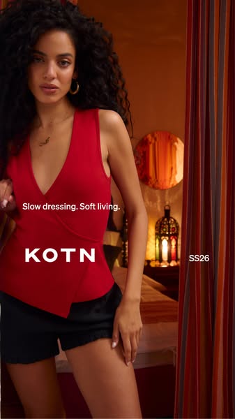The ad showcases KOTN's red top and emphasizes the brand's commitment to slow dressing and soft living. The imag