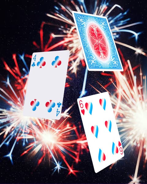 This image ad features playing cards floating in front of a firework display. The colors are predominately red, white, a