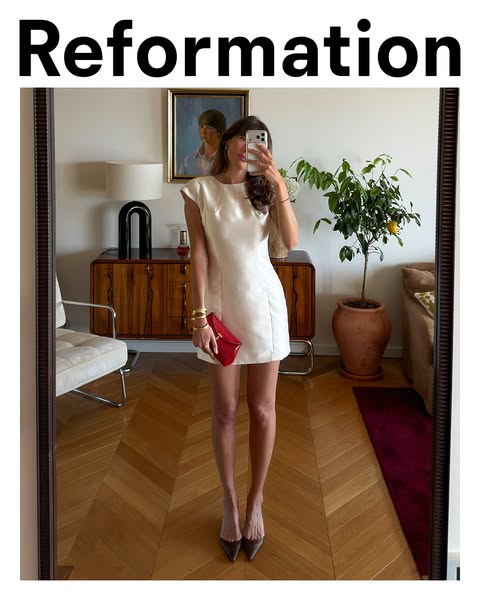 This ad displays the brand Reformation by showing a woman in a white dress, holding a red purse, and taking a mirror sel