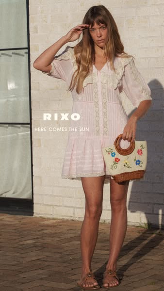 This image ad features a woman modeling a light pink RIXO dress with a white purse and the copy "Here Comes the Sun