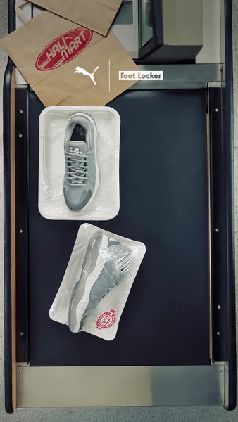 This ad creates an unexpected visual by presenting Puma sneakers in food packaging inside a supermarket checkout. The vi