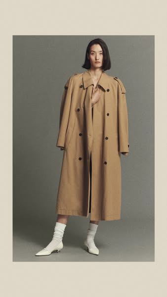 This ad features a photo of a person modeling a trench coat, standing in front of a neutral background.