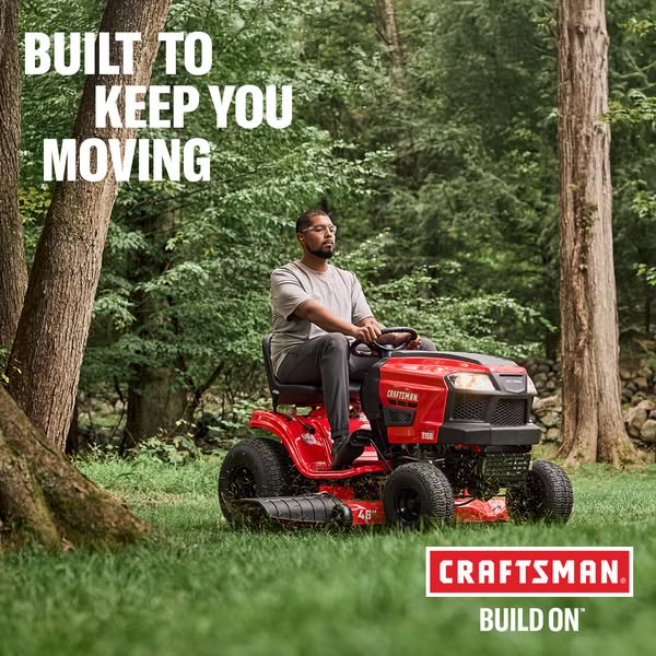This image ad features a Craftsman riding lawn mower being used by a person in a grassy, wooded outdoor setting. The ad 