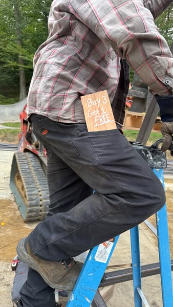 This ad features an image of a person wearing work pants with a wooden sign in the back pocket offering a 'buy 3 get