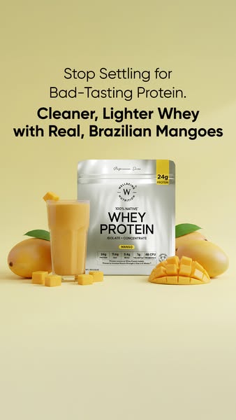 This ad features a Whey Protein product from Wellbeing Nutrition. It showcases the product alongside fresh mangoes to em