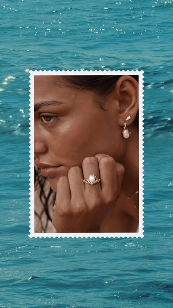 This ad features a close-up of a woman wearing pearl jewelry. The ad is formatted like a postage stamp and has a sea-the
