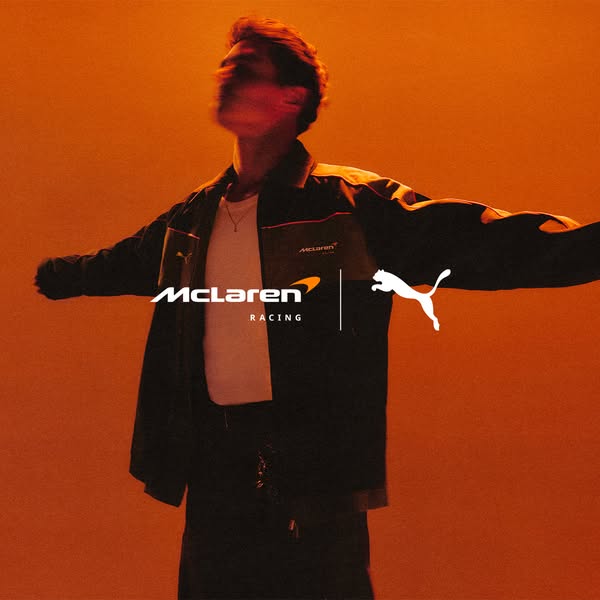 This ad features a photo of an unknown male wearing a McLaren and Puma co-branded jacket. It is advertising the apparel 