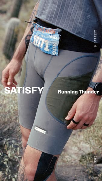 Close up photo of a runner with a slim waist pack, wearing running shorts from Satisfy.
