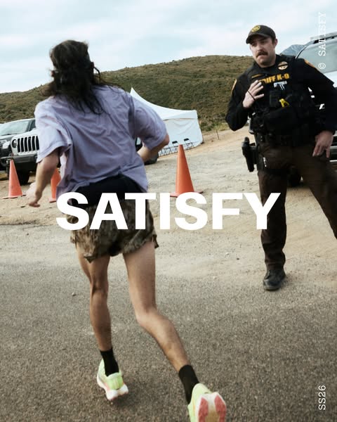 The ad features a runner in athletic gear being chased by a police officer in uniform. The promoted brand's name is 