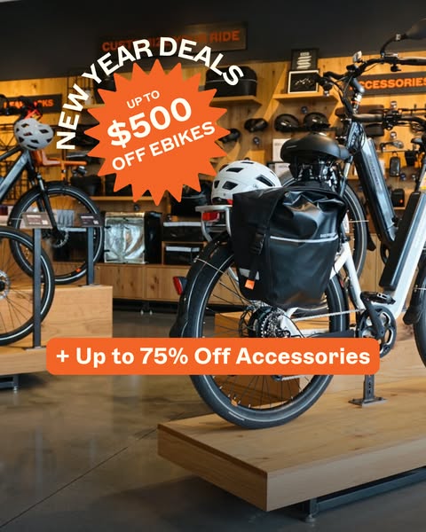 This ad showcases e-bikes and accessories with a New Year's deal, offering up to $500 off e-bikes and up to 75% off 