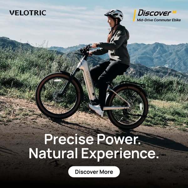 This image ad showcases the Velotric Discover Mid-Drive Commuter Ebike. It features a cyclist on a dirt path with mounta
