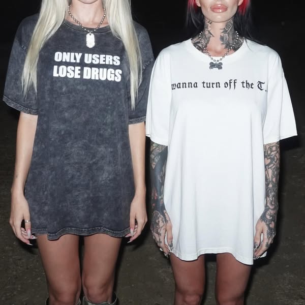This ad features two women wearing t-shirts with edgy slogans. The ad is likely targeting a younger audience interested 