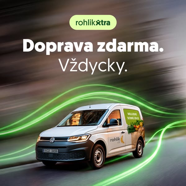 The ad features a Rohlik delivery van in motion, emphasizing the brand's promise of free and always-available delive