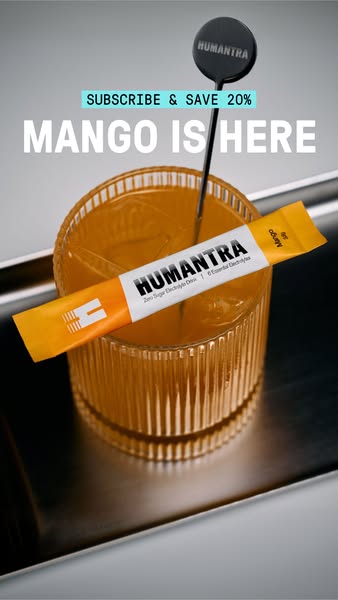This ad showcases HUMANTRA's Mango Zero Sugar Electrolyte Drink. It features a glass filled with the prepared drink,