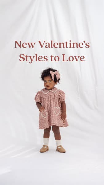 This ad showcases a young girl wearing a Valentine's Day-themed dress and hair bow. The ad highlights the new Valent