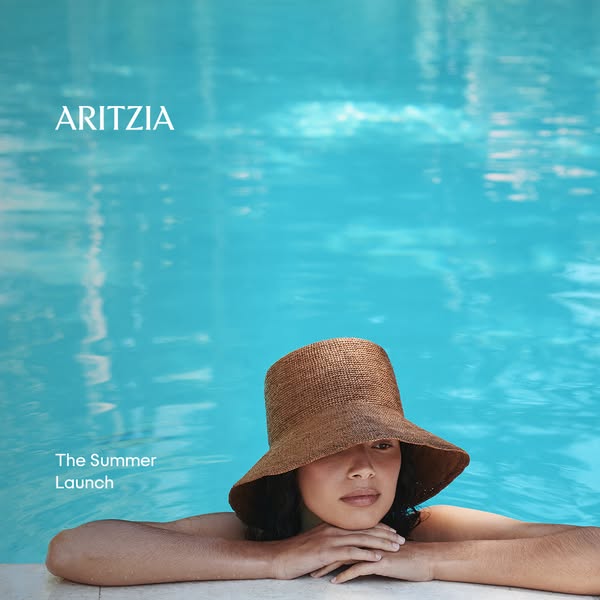 This image ad for Aritzia showcases a straw hat from their summer collection while featuring a woman in a turquoise pool