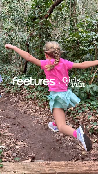 This ad features an active young girl jumping during a run on a forest trail. It showcases the collaboration between Fee