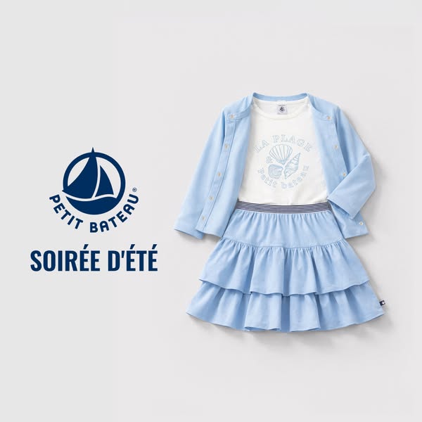 This image ad showcases Petit Bateau children's clothing, featuring a coordinated light blue skirt, cardigan, and wh