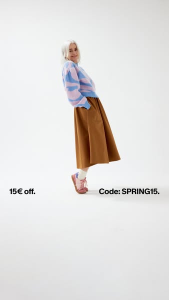 The ad is for clothing, offering a discount. The model is wearing the clothing in the ad.