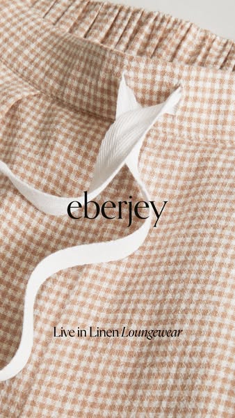 A close-up shot of Eberjey linen loungewear, focusing on the fabric and material. The ad emphasizes comfort and high-qua