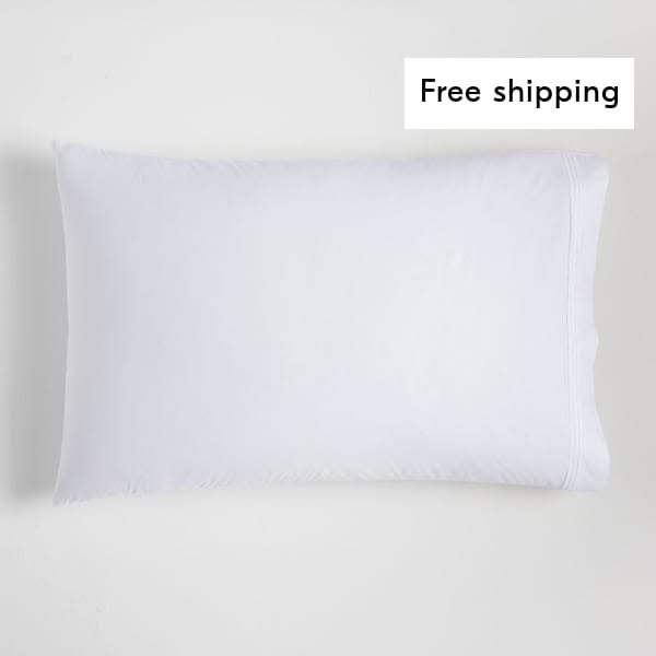 This ad features a white pillow and promotes free shipping.