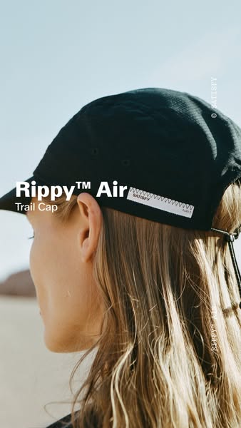 An image ad for the Satisfy Rippy™ Air Trail Cap featuring a person wearing the product in an outdoor setting.