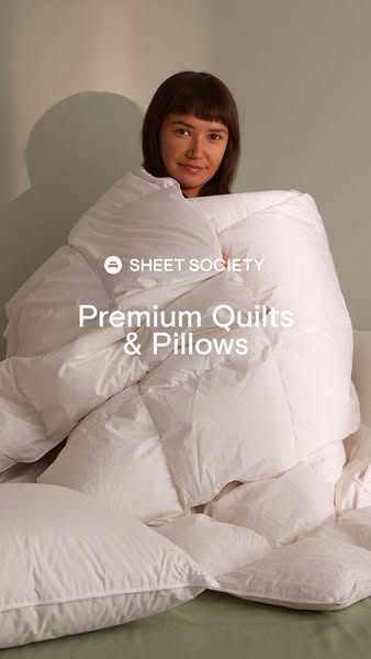 This ad showcases Sheet Society's premium quilts and pillows, emphasizing comfort and quality through a cozy visual 
