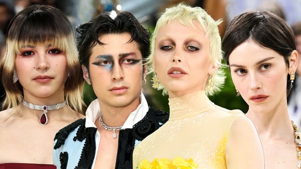 This ad features four high fashion models wearing dramatic makeup.