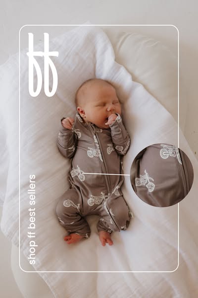 This ad features an image of a baby wearing a Footies brand onesie that is patterned with a white motorcycle design. The