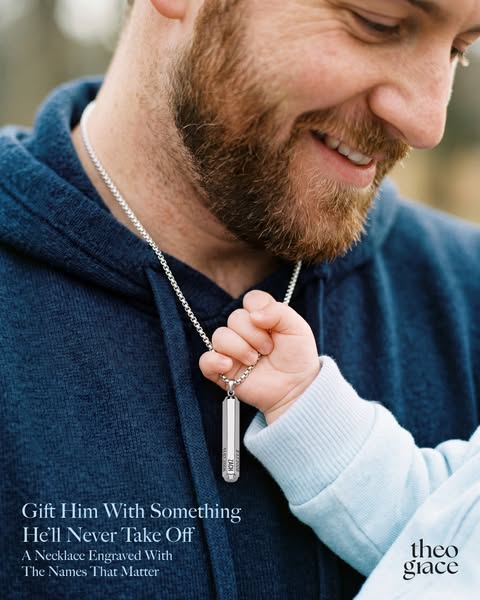 This ad features a close up image of a man wearing a necklace with an engraved pendant. The pendant is being held by a b