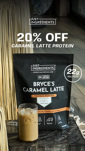 This image ad for Just Ingredients promotes their Bryce's Caramel Latte Protein Powder with a 20% off offer. The ad 